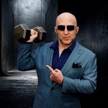 The Shadow Priest holding a dumbbell like a hypnotist's pocket watch