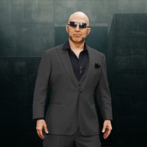 Dominant master - The Shadow Priest, brutalist background behind him